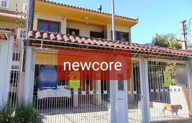 Imagem: A casa possui 3 Dormitórios, 3 Banheiros, 2 Vagas na garagem