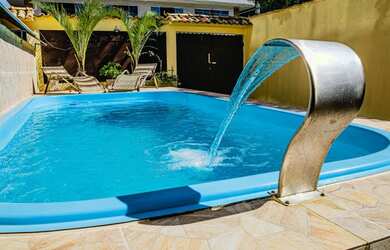 Imagem: A casa possui 4 Dormitórios, 2 Vagas na garagem e está localizado