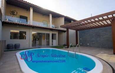 Imagem: A casa possui 3 Dormitórios, 4 Banheiros, 5 Vagas na garagem