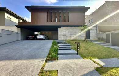 Imagem: A casa possui 4 Dormitórios, 5 Banheiros, 5 Vagas na garagem