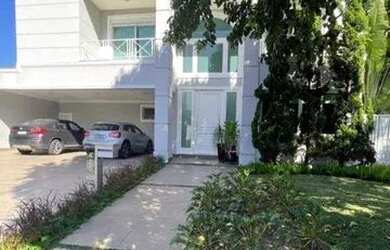 Imagem: A casa possui 4 Dormitórios, 4 Banheiros, 5 Vagas na garagem