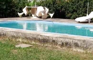 Imagem: A casa possui 5 Dormitórios, 5 Banheiros, 5 Vagas na garagem