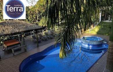 Imagem: A casa em condomínio possui 5 Dormitórios, 5 Banheiros, 5