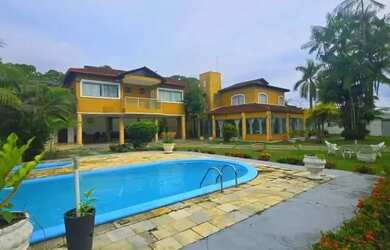 Imagem: A casa possui 5 Dormitórios, 5 Banheiros, 3 Vagas na garagem