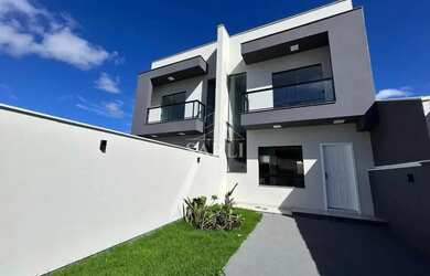 Imagem: A casa possui 2 Dormitórios, 3 Banheiros, 2 Vagas na garagem