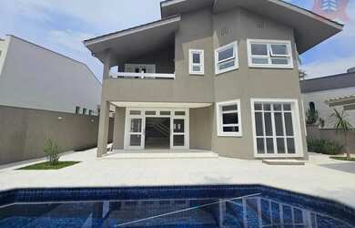 Imagem: A casa possui 4 Dormitórios, 5 Banheiros, 5 Vagas na garagem