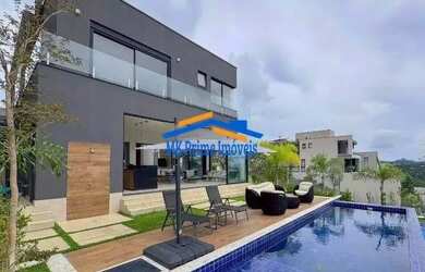 Imagem: A casa em condomínio possui 4 Dormitórios, 5 Banheiros, 4