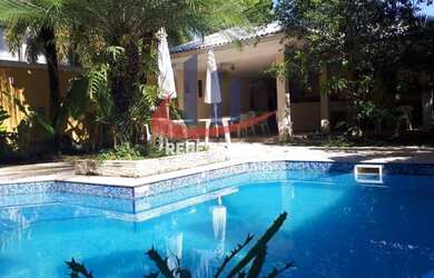 Imagem: A casa em condomínio possui 5 Dormitórios, 5 Banheiros, 4