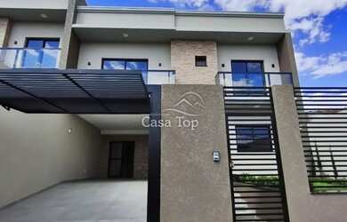 Imagem: A casa possui 3 Dormitórios, 3 Banheiros, 2 Vagas na garagem