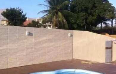 Imagem: A casa possui 3 Dormitórios, 4 Banheiros, 5 Vagas na garagem