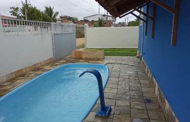 Imagem: A casa possui 3 Dormitórios e 3 Vagas na garagem e está localizado