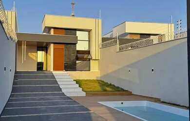 Imagem: A casa possui 3 Dormitórios, 4 Banheiros, 5 Vagas na garagem