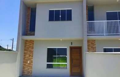 Imagem: A casa possui 3 Dormitórios, 1 Banheiro, 2 Vagas na garagem