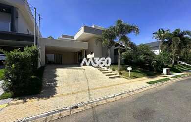 Imagem: A casa possui 3 Dormitórios, 5 Banheiros, 4 Vagas na garagem