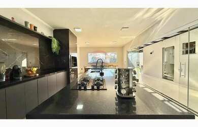 Imagem 5: Casa moderna com acabamento fino no jardim Flamboyant