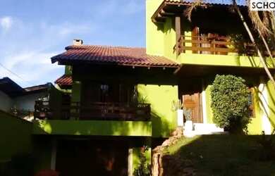 Imagem: A casa possui 4 Dormitórios, 4 Banheiros, 4 Vagas na garagem