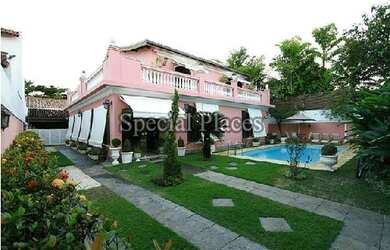 Imagem: A casa em condomínio à venda possui 4 Dormitórios, 5 Banheiros