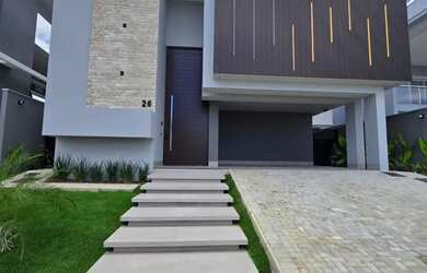 Imagem: A casa possui 4 Dormitórios, 5 Banheiros, 4 Vagas na garagem