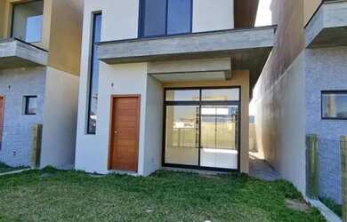 Imagem: A casa possui 3 Dormitórios, 2 Banheiros, 1 Vaga na garagem