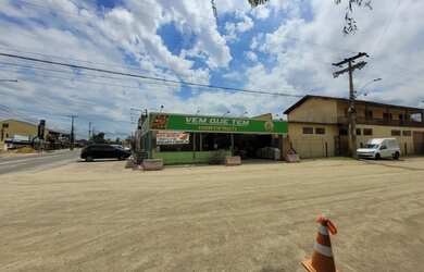 Imagem: A casa possui 3 Dormitórios, 2 Banheiros, 1 Vaga na garagem