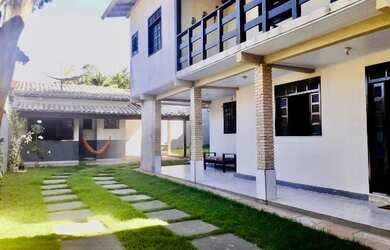 Imagem: A casa possui 3 Dormitórios, 3 Vagas na garagem e está localizado