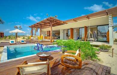 Imagem: A casa possui 3 Dormitórios, 5 Banheiros, 3 Vagas na garagem