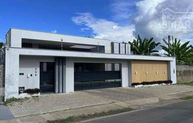 Imagem: A casa possui 3 Dormitórios, 5 Banheiros, 3 Vagas na garagem