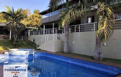 Imagem: A casa possui 5 Dormitórios, 5 Banheiros, 5 Vagas na garagem