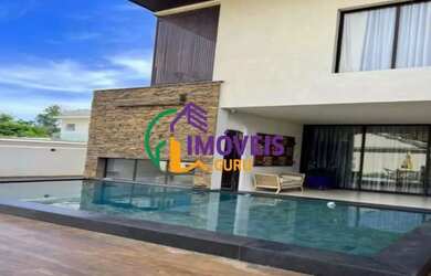 Imagem: A casa possui 4 Dormitórios, 5 Banheiros, 4 Vagas na garagem