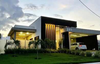 Imagem: A casa possui 4 Dormitórios, 4 Banheiros, 4 Vagas na garagem