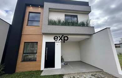 Imagem: A casa em condomínio possui 2 Dormitórios, 3 Banheiros e 122m²