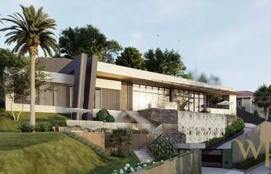 Imagem: A casa possui 3 Dormitórios, 5 Banheiros, 2 Vagas na garagem