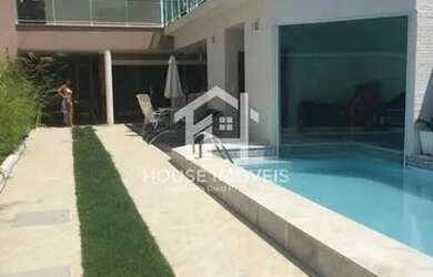 Imagem: A casa possui 5 Dormitórios, 4 Banheiros, 4 Vagas na garagem