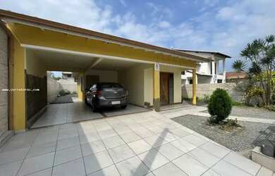 Imagem: A casa possui 3 Dormitórios, 2 Banheiros, 2 Vagas na garagem