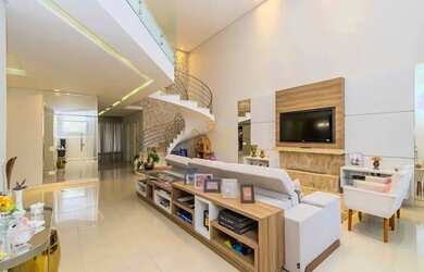 Imagem: A casa possui 3 Dormitórios, 5 Banheiros, 4 Vagas na garagem