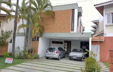 Imagem: A casa possui 4 Dormitórios, 5 Banheiros, 5 Vagas na garagem