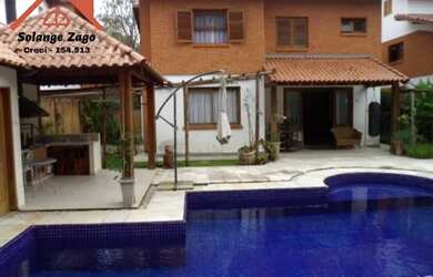 Imagem: A casa possui 4 Dormitórios, 5 Banheiros, 5 Vagas na garagem