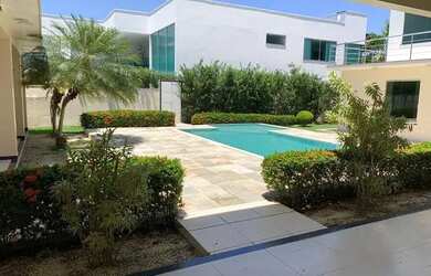 Imagem: A casa possui 4 Dormitórios, 5 Banheiros, 4 Vagas na garagem