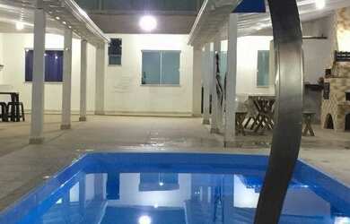 Imagem: A casa possui 3 Dormitórios, 4 Vagas na garagem e está localizado