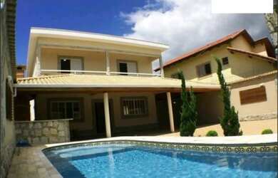 Imagem: A casa possui 5 Dormitórios, 5 Banheiros, 5 Vagas na garagem