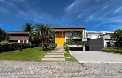 Imagem: A casa possui 5 Dormitórios, 5 Banheiros, 5 Vagas na garagem