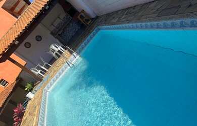 Imagem: A casa possui 3 Dormitórios, 2 Vagas na garagem e está localizado