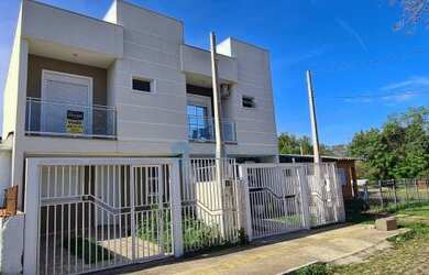 Imagem: A casa possui 2 Dormitórios, 3 Banheiros, 1 Vaga na garagem