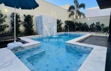 Imagem: A casa em condomínio possui 4 Dormitórios e está localizado