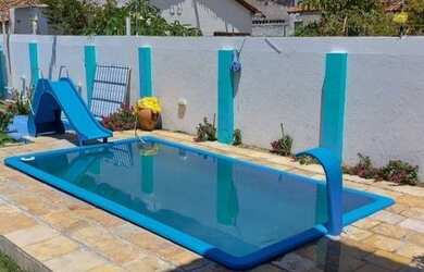 Imagem: A casa possui 4 Dormitórios, 4 Banheiros, 4 Vagas na garagem