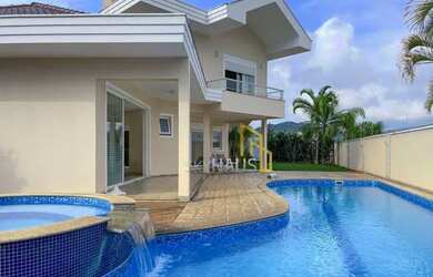 Imagem: A casa possui 4 Dormitórios, 5 Banheiros, 5 Vagas na garagem