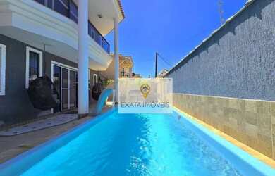 Imagem: A casa possui 4 Dormitórios, 4 Banheiros, 2 Vagas na garagem