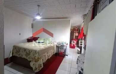 Imagem: A casa possui 2 Dormitórios, 3 Banheiros, 4 Vagas na garagem