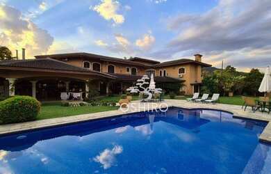 Imagem: A casa possui 5 Dormitórios, 5 Banheiros, 3 Vagas na garagem