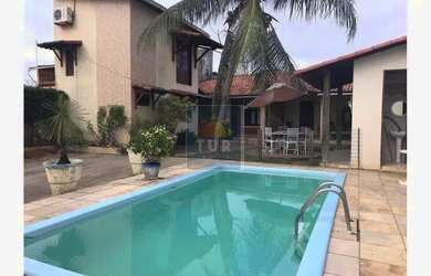 Imagem: A casa possui 4 Dormitórios, 4 Banheiros, 4 Vagas na garagem